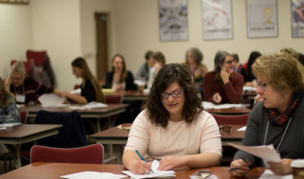 A KMA Member takes notes during the annual conference.